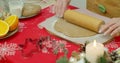 Flat lay. Step by step. Rolling out gingerbread cookie dough to bake Christmas cookies. Royalty Free Stock Photo