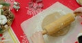 Flat lay. Step by step. Rolling out gingerbread cookie dough to bake Christmas cookies. Royalty Free Stock Photo