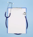 Flat lay of stethoscope and writing pad paper clip board on light blue background with copy space, healthcare and medical concept Royalty Free Stock Photo