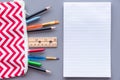 Lined paper on table beside pencil case full of stationery supplies Royalty Free Stock Photo