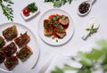 Flat lay with stuffed cabbage rolls and ingredients on white background