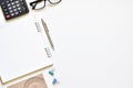 Flat lay style, Top view white table desk with copy space has book, pencil, glasses, calculator is elements. Royalty Free Stock Photo