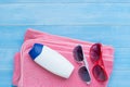 Flat lay of summer beach accessories on light blue wood plank fl Royalty Free Stock Photo