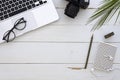 Flat lay summer freelancer workspace. Computer, and photo camera top view summer business background mockup