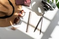 Flat lay of summer items with green tropical leaf shadow on white desk. Summer, holiday and planning travel concepts. top view and Royalty Free Stock Photo