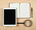 Flat Lay Of Tablet Computer, Notebook, Coffee Cup And Pencil With Blank Center On Wood Background, Top View