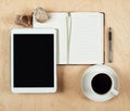Flat Lay Of Tablet Computer, Notebook, Coffee Cup And Pencil With Blank Center On Wood Background, Top View