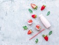 Flat lay Tasty strawberry milk shake in bottle on white background. Royalty Free Stock Photo