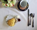Flat lay tea and scone serving on white tablecloth Royalty Free Stock Photo