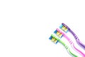 Flat lay, three toothbrushes of different colors on a white background close-up, place for text Royalty Free Stock Photo