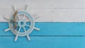 Flat lay of tiller boat sail steering wheel on white and blue wooden background sailing marin copy space Royalty Free Stock Photo