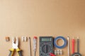 Flat lay, tools and equipment of an electrical engineer or professional worker on a craft background, place for text Royalty Free Stock Photo