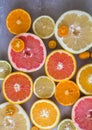 Flat lay top view of beautiful variety of fresh citrus fruits half cut. Oranges, lemons , clementine, red grapefruit. Royalty Free Stock Photo