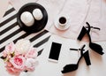 Flat lay, top view. Beauty blog concept. Woman fashion accessories, shoes, bouquet of roses and pions, coffee and phone Royalty Free Stock Photo