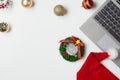 Flat lay top view Christmas office table desk party concept, Christmas workspace with laptop, Santa Claus hat and Christmas Royalty Free Stock Photo