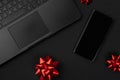 Flat lay top view composition laptop, smartphone and bow. Black friday sale mockup