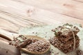 Flat lay top view crunchy flax seed crispbread with dry vegetable and linseed spoon on wooden rustic background with