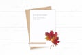 Flat lay top view elegant white composition letter kraft paper envelope autumn red maple leaf pencil and vintage metal scissors on