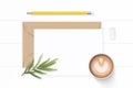 Flat lay top view elegant white composition letter kraft paper envelope yellow pencil eraser tarragon leaf and coffee on wooden