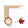 Flat lay top view elegant white composition paper brown kraft envelope autumn maple leaf tag and coffee on wooden background Royalty Free Stock Photo