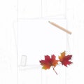 Flat lay top view elegant white composition paper brown pencil eraser and red autumn maple leaf on wooden background Royalty Free Stock Photo