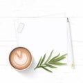 Flat lay top view elegant white composition paper coffee drink tarragon leaf and pencil eraser on wooden background