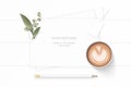 Flat lay top view elegant white composition paper plant leaf flower pencil and coffee on wooden background Royalty Free Stock Photo