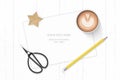 Flat lay top view elegant white composition paper yellow pencil star craft coffee and vintage metal scissors on wooden background