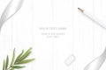 Flat lay top view elegant white composition silver ribbon pencil tarragon leaf and eraser on wooden floor background