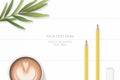 Flat lay top view elegant white composition yellow pencils eraser tarragon leaf and coffee on wooden floor background