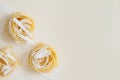 Flat lay top view fettuccine pasta on a white background copy space