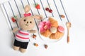 Flat lay, top view, food and beverage in white background, cute crochet brown bunny eating healthy breakfast meal with croissants,