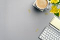 Flat lay top view home office desk table. Workspace with computer keyboard, coffee cup, paper notebook, yellow stationery and Royalty Free Stock Photo