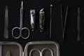 Flat lay, top view manicure pedicure equipment on black background