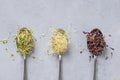 Flat lay top view of microgreens assortment on gray concrete background. Fresh alfalfa sprouts, broccoli flower buds