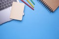 Flat lay top view mockup photo of working space with laptop, pens and notebook