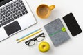 Flat lay top view modern laptop, food and stationery on white table