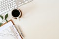 Flat lay top view office desk. Workspace with keyboard and office supplies, pencil, green leaf with coffee on white background. Royalty Free Stock Photo