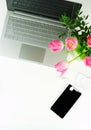 Top view office feminine desk and bouquet pink tulips