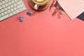 Flat lay, top view office table desk. Workspace with blank clip board, keyboard, office supplies, pencil, green leaf, and coffee c