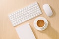 Flat lay, top view office table desk. Workspace with blank note book, keyboard, office supplies and coffee cup on wooden Royalty Free Stock Photo