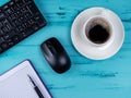 Flat lay, top view office table desk. Workspace with blank note book, keyboard, office supplies and coffee cup on wooden Royalty Free Stock Photo