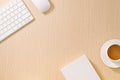 Flat lay, top view office table desk. Workspace with blank note book, keyboard, office supplies and coffee cup on wooden Royalty Free Stock Photo