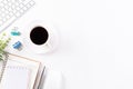 Flat lay, top view office table desk. Workspace with keyboard, office supplies, pencil and coffee cup with copy space on white Royalty Free Stock Photo