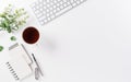 Flat lay, top view office table desk. Workspace with keyboard, office supplies, pencil and coffee cup with copy space on white Royalty Free Stock Photo