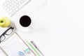 Flat lay, top view office table desk. Workspace with keyboard, office supplies, pencil, green apple, and coffee cup with copy Royalty Free Stock Photo