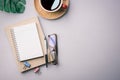 Flat lay, top view office table desk. Workspace with keyboard, office supplies, pencil, green leaf, and coffee cup on gray Royalty Free Stock Photo