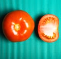 Flat lay, top view. Red ripe tomatoes on bright green background