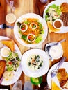 Flat lay and Top view of salad, grilled beef steak, half of butter bread, spinach with cheese, mushroom soup and many drink on the Royalty Free Stock Photo