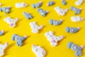 Flat lay top view tasty appetizing concept, Marshmallows in the shape white and gray mice or rats on a yellow background Royalty Free Stock Photo